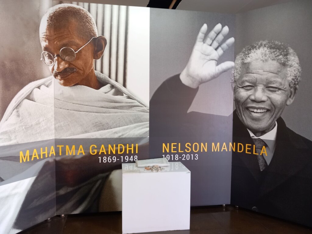 This photo shows images of Nelson Mandela and Mahatma Gandhi at the entrance to the exhibition about their parallel lives