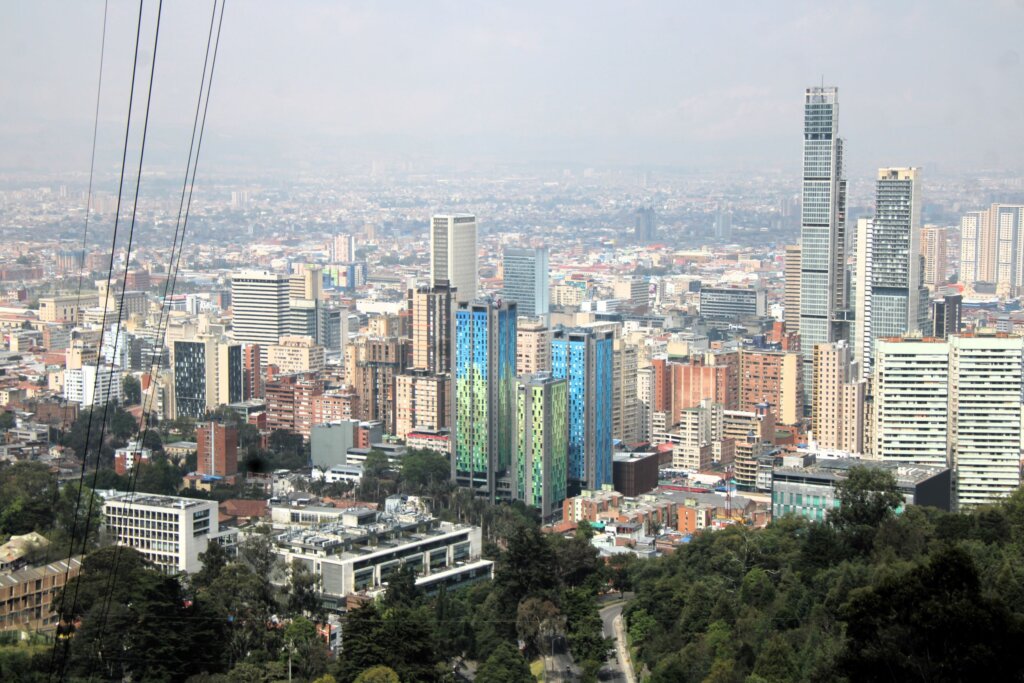 This image shows numerous skyscrapers in Bogota as viewed from the top of Monserrate